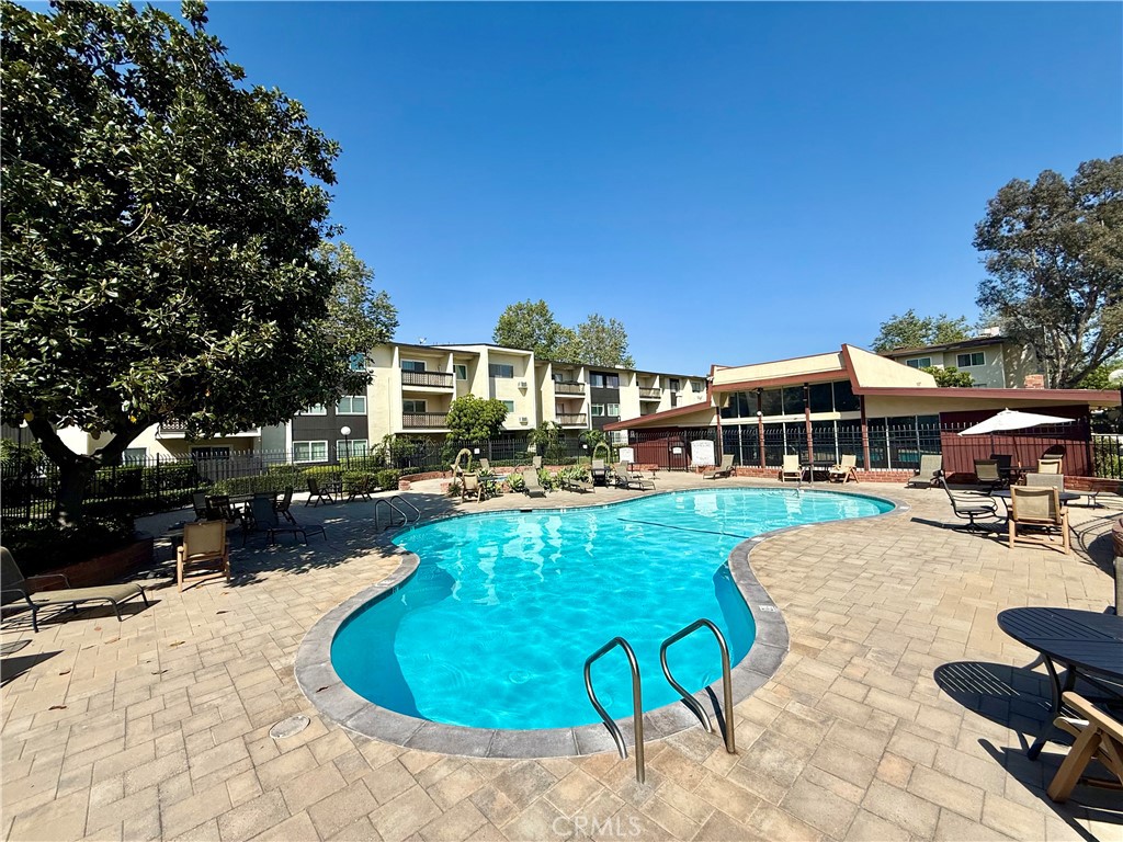 12200 Montecito Road, Unit D221 Seal Beach, CA 90740 - Photo 13 of 27 a view of a house with swimming pool and sitting area