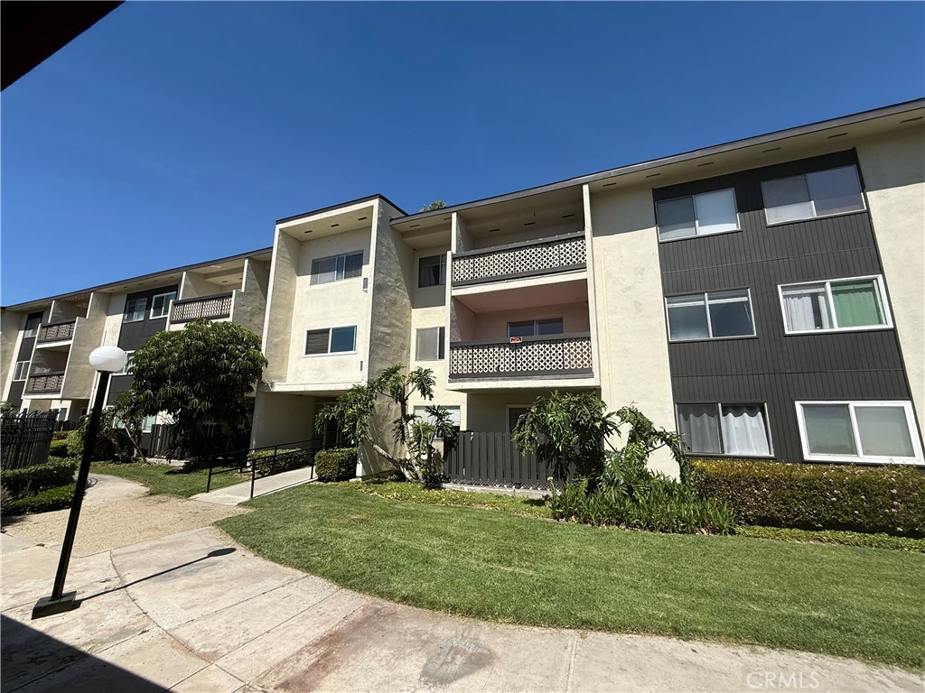 12200 Montecito Road, Unit D221 Seal Beach, CA 90740 - Photo 20 of 27 a front view of house with yard