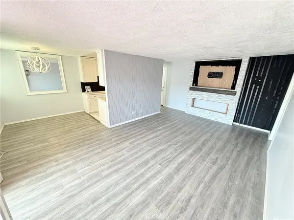 a view of a livingroom with wooden floor