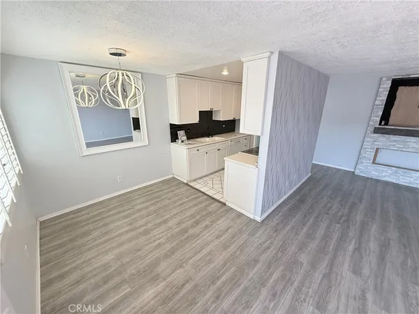 a view of kitchen and wooden floor