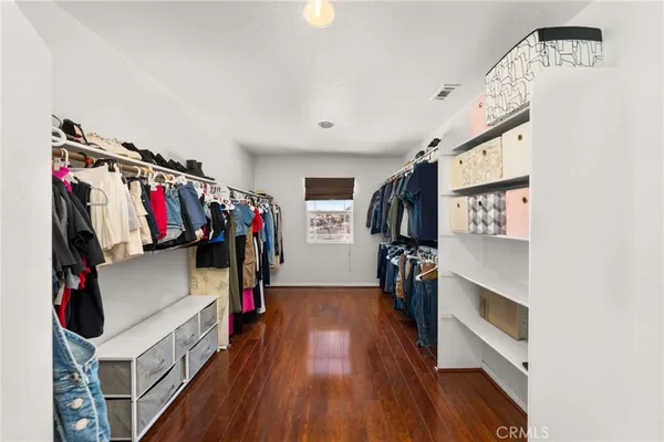 a bedroom with a bed and a ceiling fan