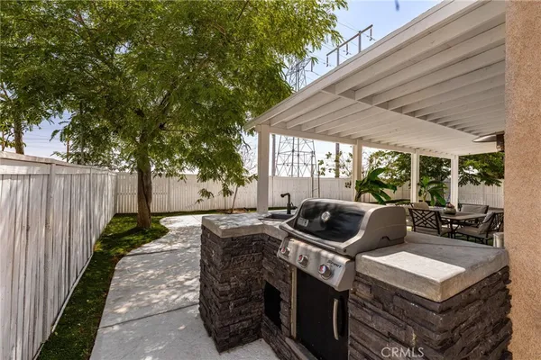 a patio with a table and chairs