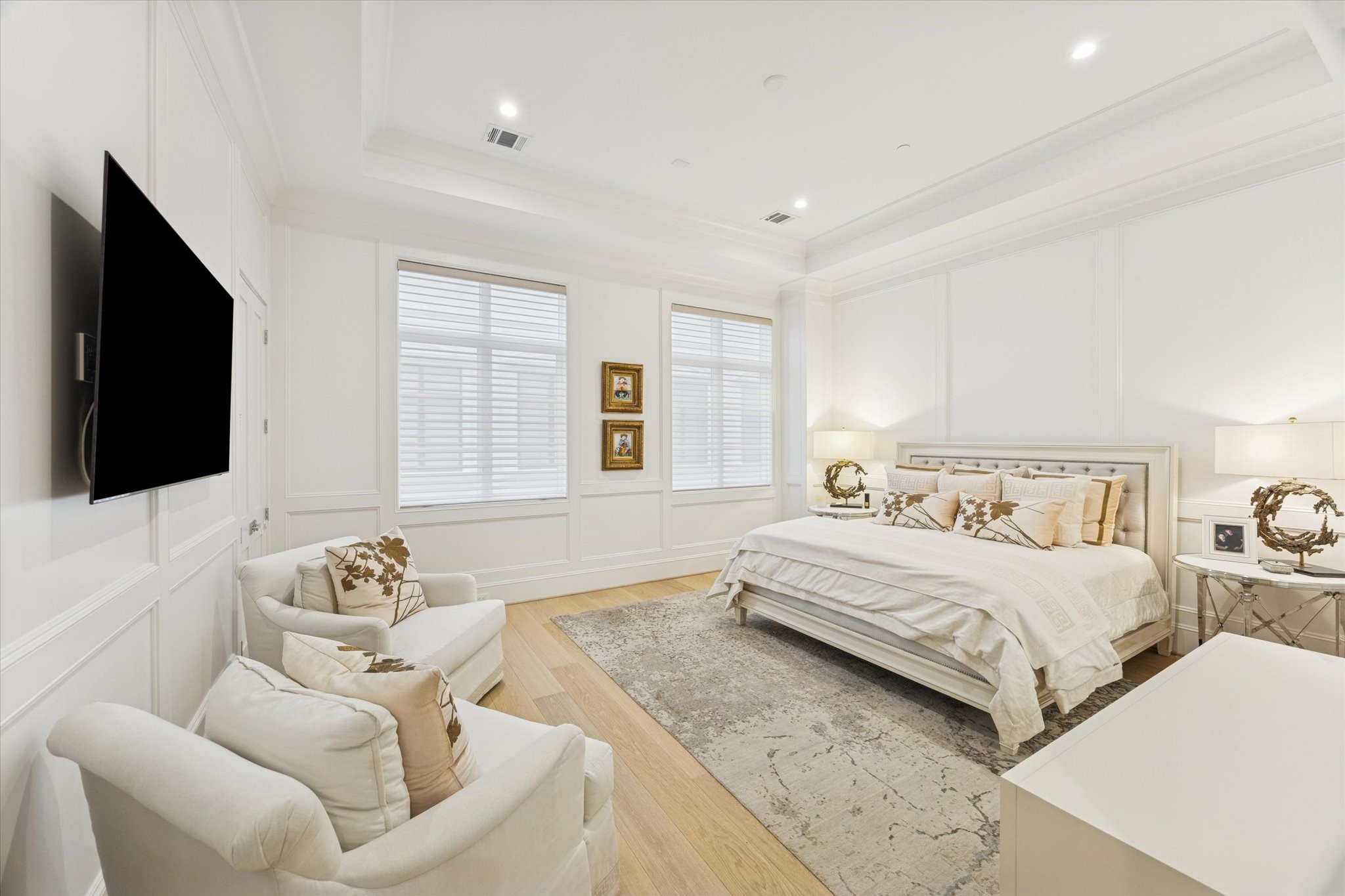 1335 Peden Street Houston, TX 77019 - Photo 14 of 37 a bedroom with a bed and a flat screen tv