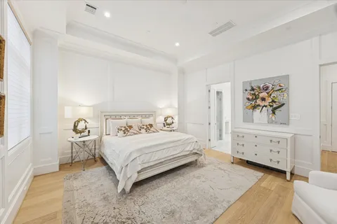 a bedroom with a bed and a cabinets