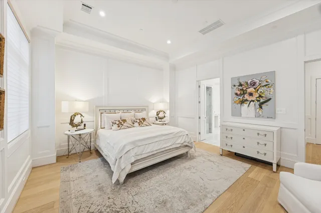 a bedroom with a bed and a cabinets