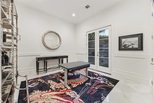 a living room with a table and a window