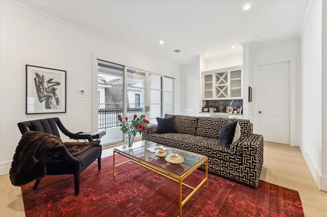 a living room with furniture rug and window