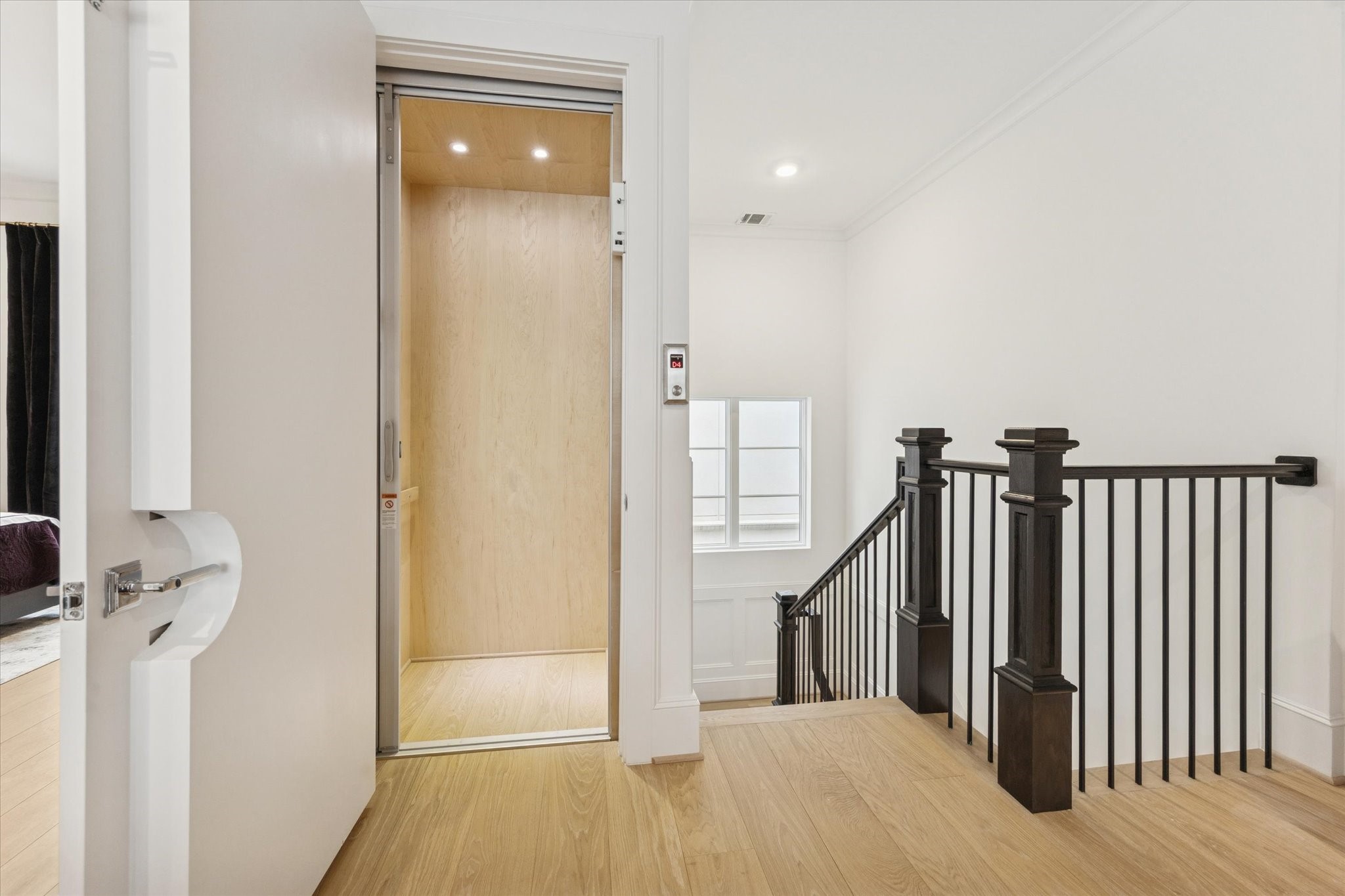 1335 Peden Street Houston, TX 77019 - Photo 26 of 37 a view of a hallway with wooden floor and staircase