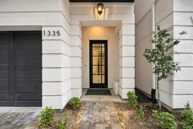a front view of a house with a garage