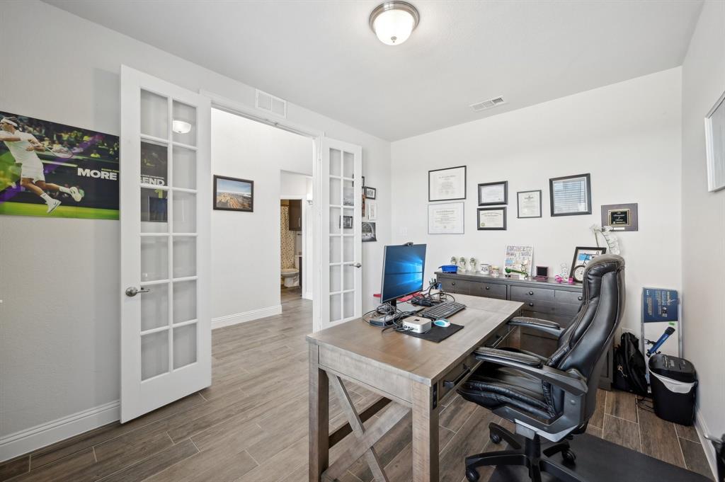 2172 Poppyvine Road Frisco, TX 75033 - Photo 17 of 40 Office area featuring french doors and wood tiled floors