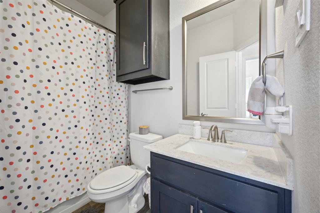 2172 Poppyvine Road Frisco, TX 75033 - Photo 19 of 40 Bathroom featuring vanity and toilet