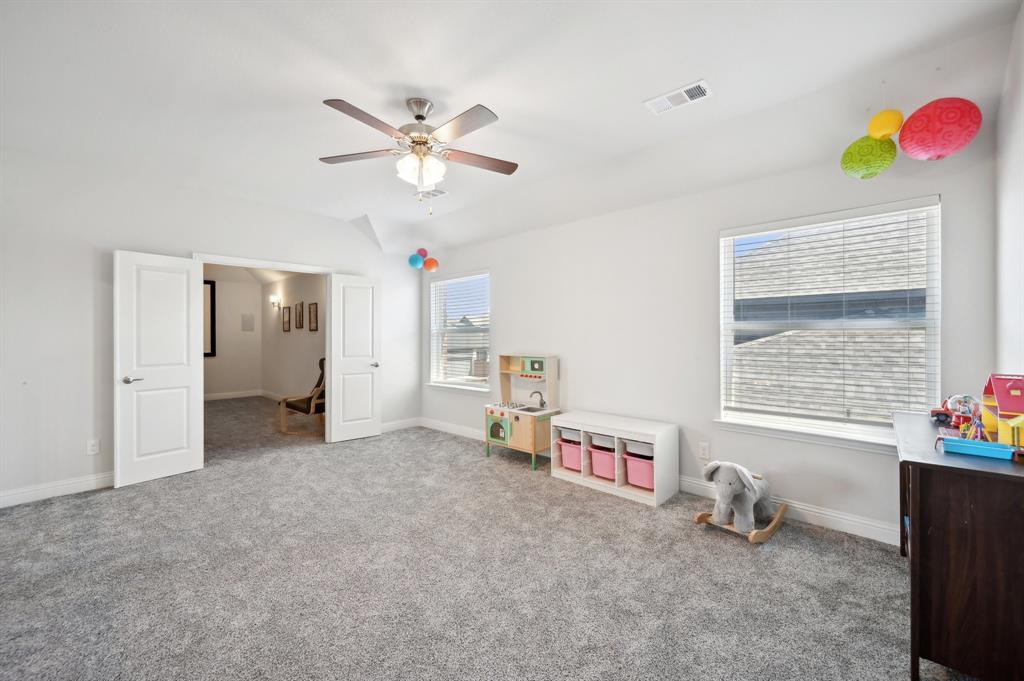 2172 Poppyvine Road Frisco, TX 75033 - Photo 29 of 40 Playroom featuring light colored carpet and a ceiling fan