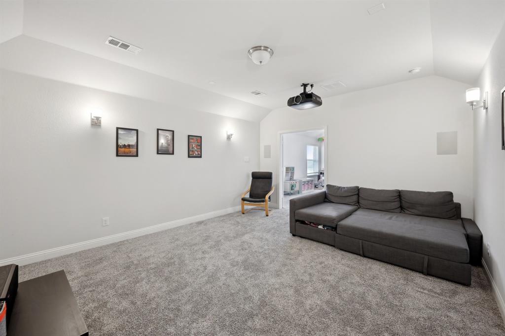 2172 Poppyvine Road Frisco, TX 75033 - Photo 32 of 40 Carpeted home theater room featuring baseboards