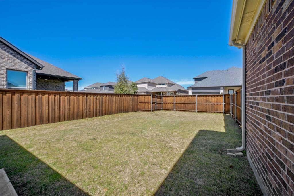 2172 Poppyvine Road Frisco, TX 75033 - Photo 33 of 40 Fenced backyard with a residential view
