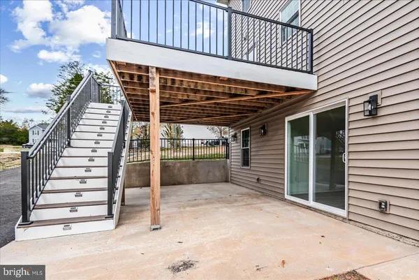 a view of a balcony with wooden floor