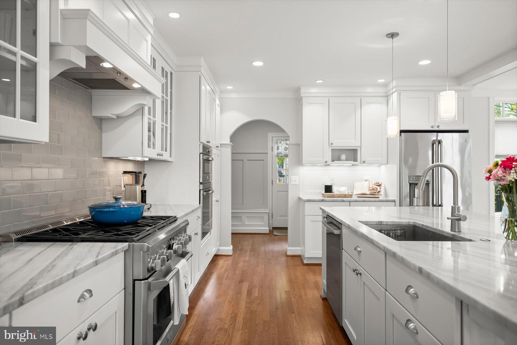 5532 14th Road North Arlington, VA 22205 - Photo 12 of 65 a kitchen with stainless steel appliances granite countertop a sink stove and refrigerator