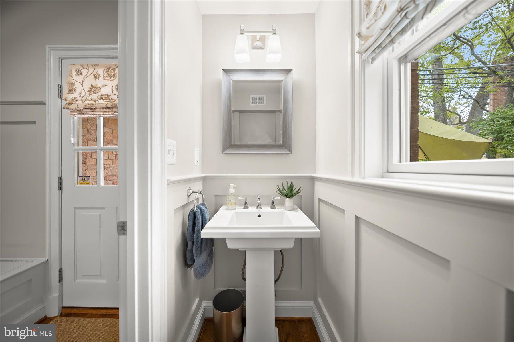 5532 14th Road North Arlington, VA 22205 - Photo 23 of 65 a bathroom with a sink and a mirror