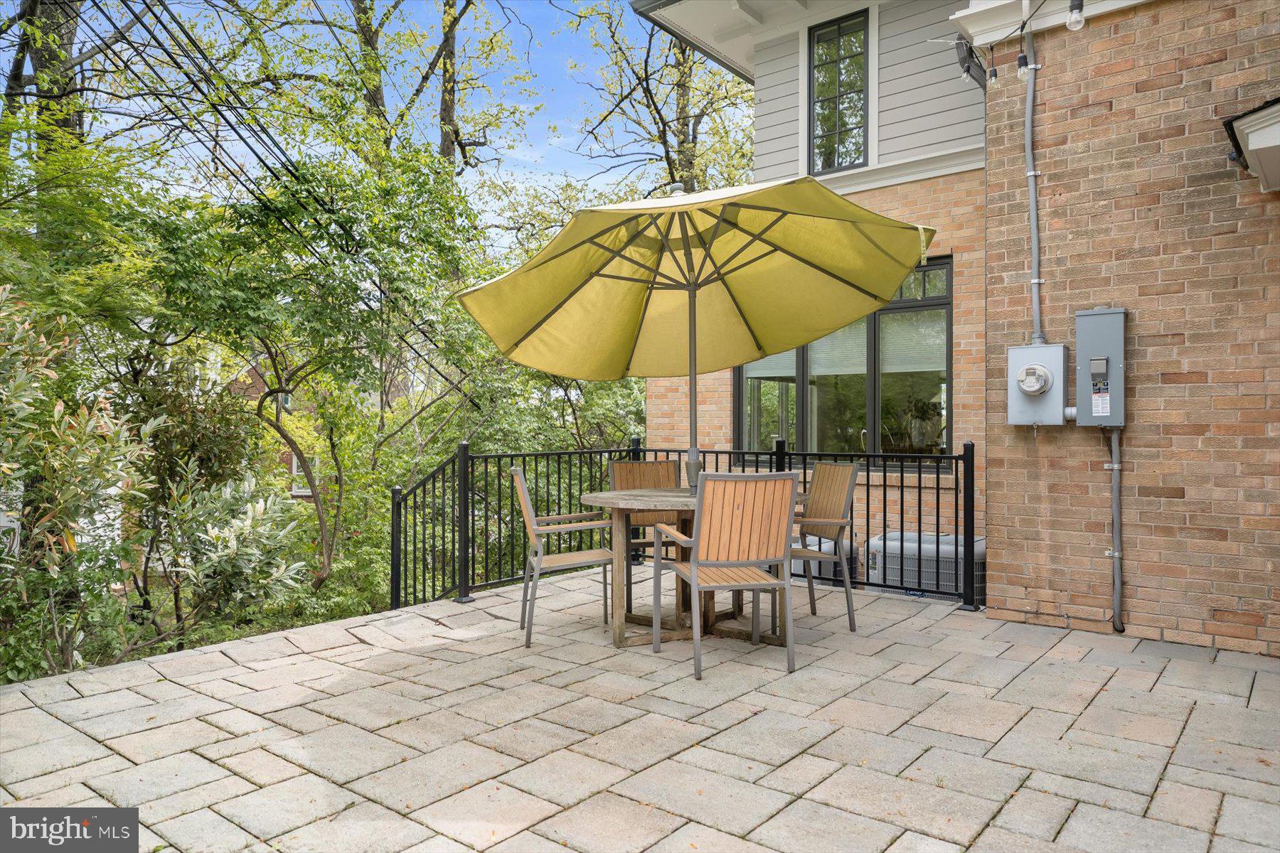 5532 14th Road North Arlington, VA 22205 - Photo 25 of 65 a view of a patio with a table and chairs under an umbrella