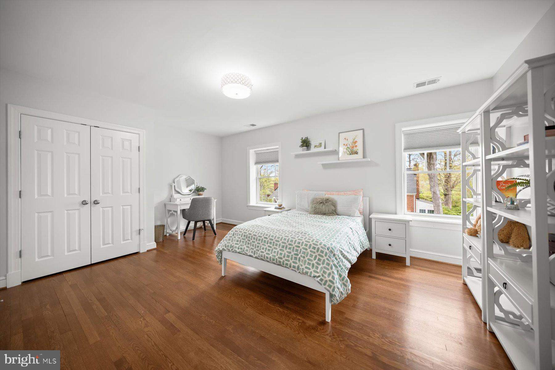 5532 14th Road North Arlington, VA 22205 - Photo 39 of 65 a spacious bedroom with a bed and a dresser in it