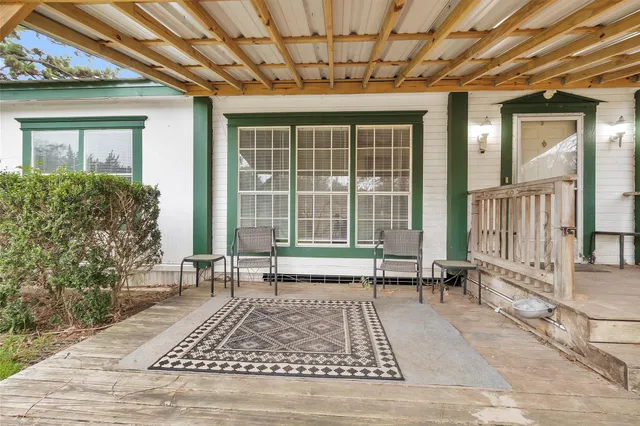 a view of house with wooden floor and a rug