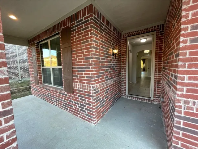 a view of an entryway door front of house