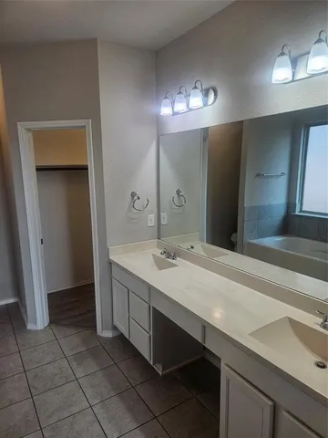 a bathroom with a sink a vanity and a mirror