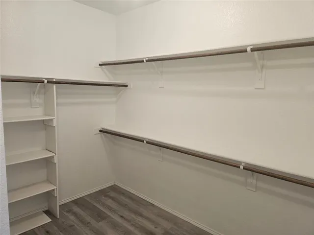 a view of an empty walk in closet