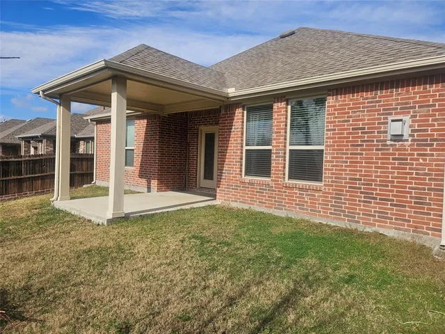 a view of a patio with chairs