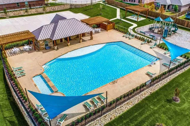 a view of a swimming pool with an outdoor space and seating area