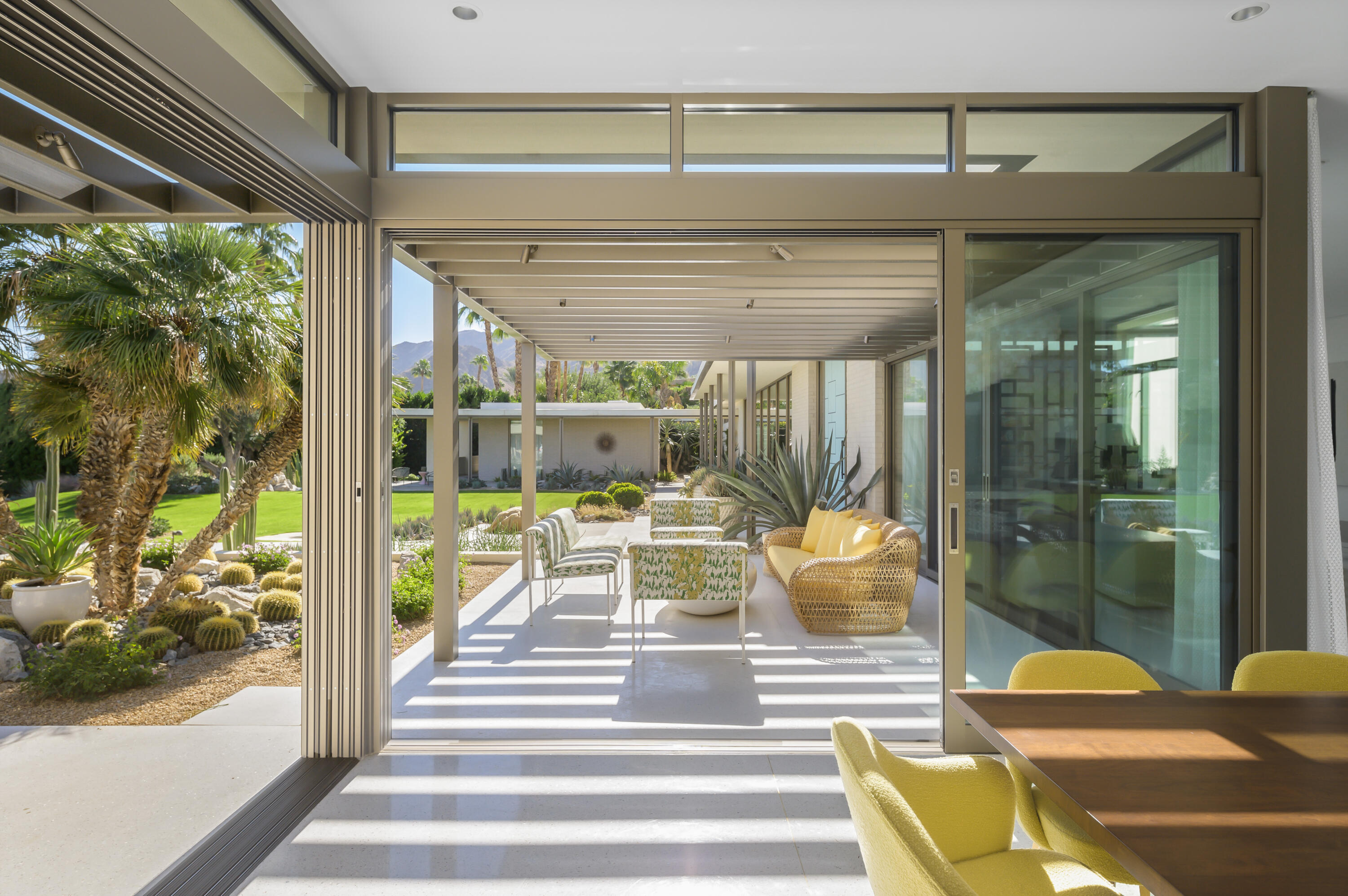 70155 Carson Road Rancho Mirage, CA 92270 - Photo 20 of 56 a view of a patio with dining table and chairs