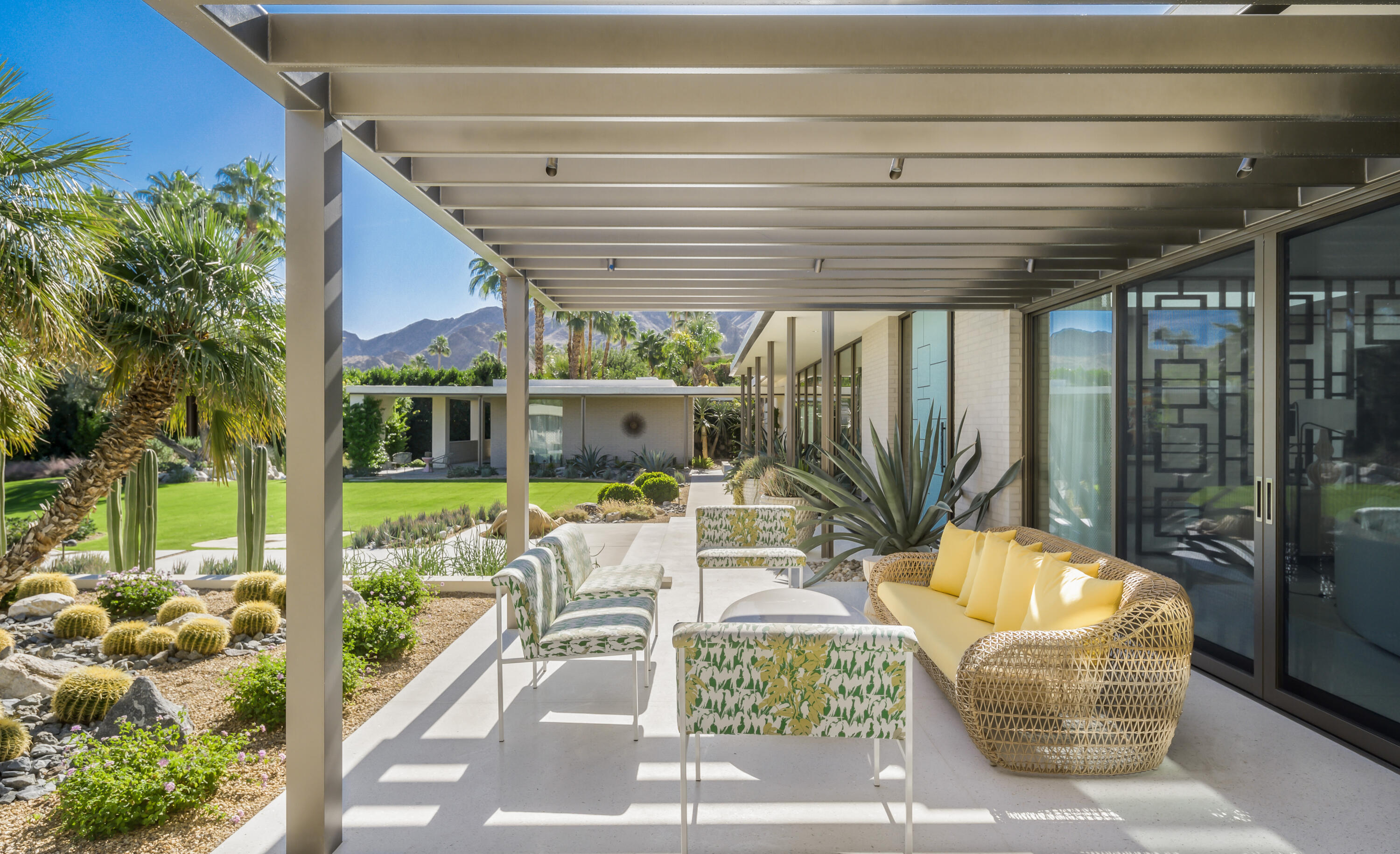 70155 Carson Road Rancho Mirage, CA 92270 - Photo 21 of 56 a view of a patio with couches chairs and a potted plant