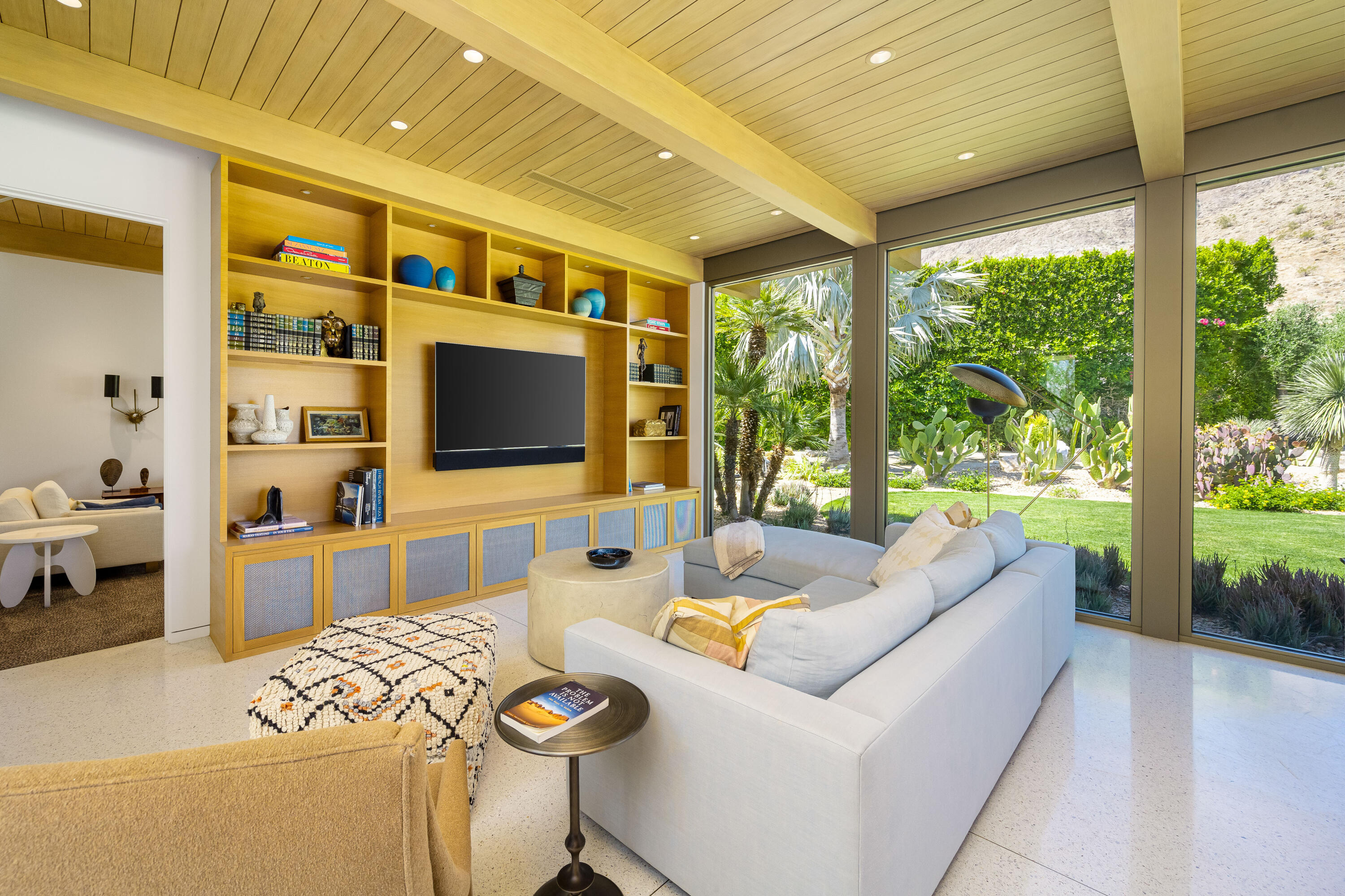 70155 Carson Road Rancho Mirage, CA 92270 - Photo 24 of 56 a living room with furniture tv and a large window