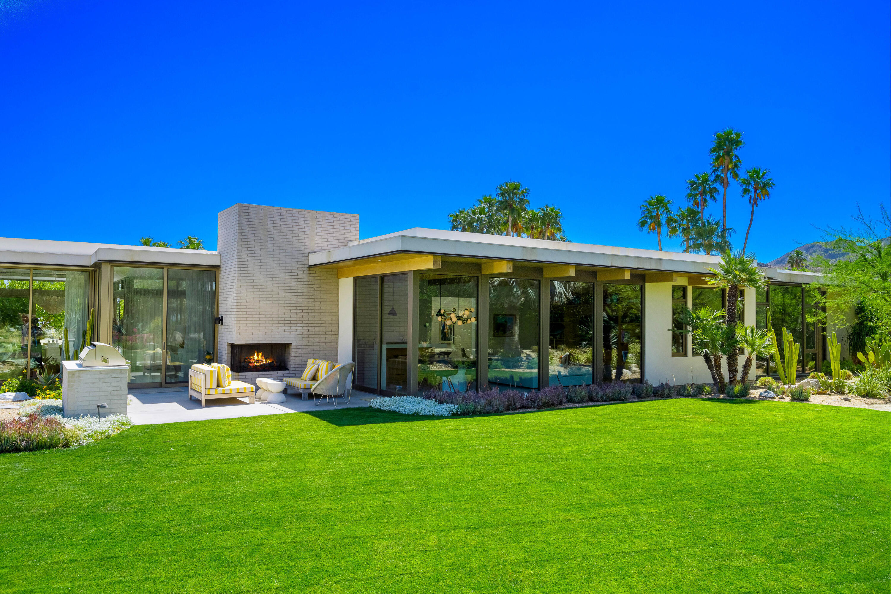 70155 Carson Road Rancho Mirage, CA 92270 - Photo 30 of 56 a view of a house with a yard porch and sitting area