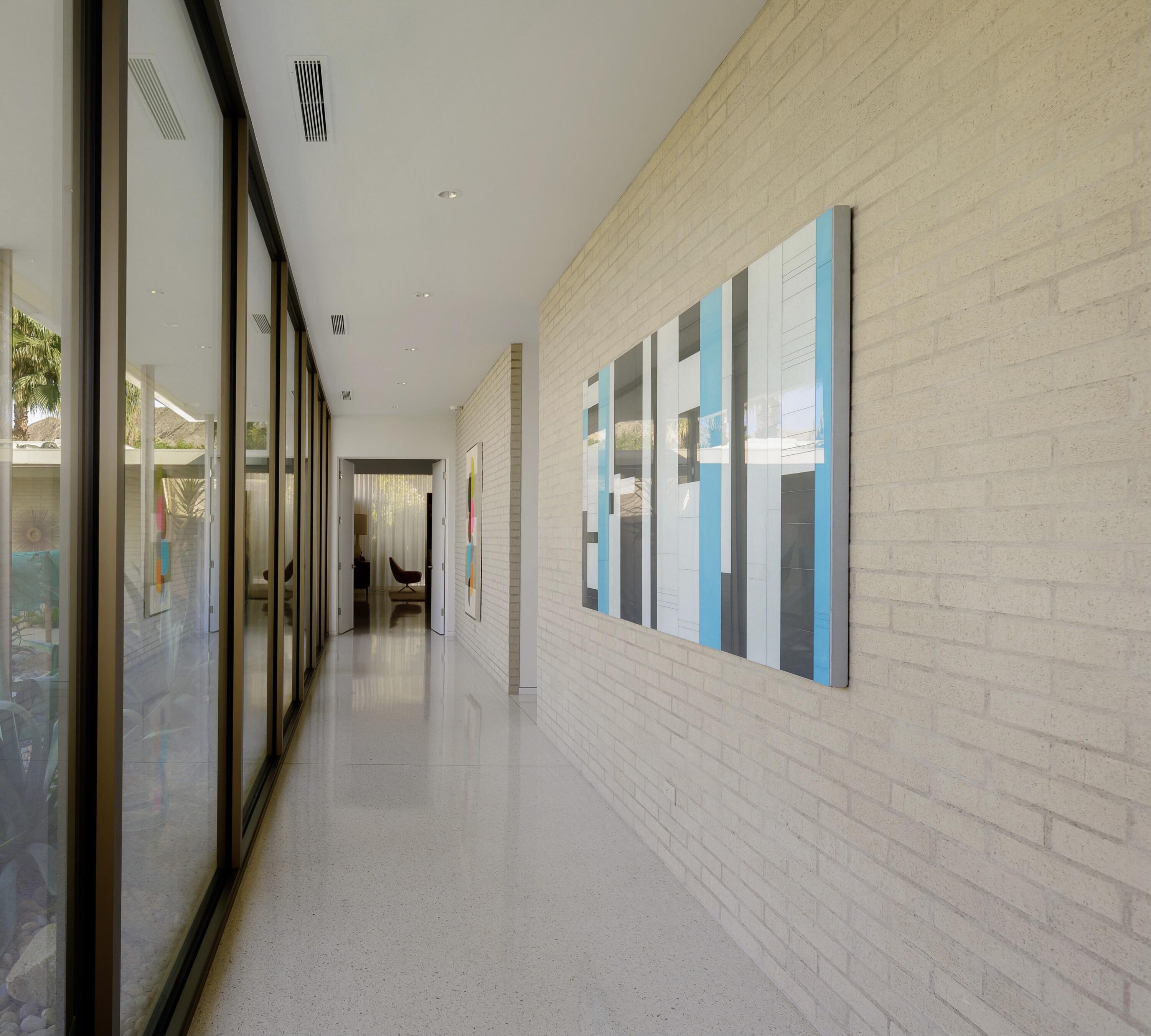 70155 Carson Road Rancho Mirage, CA 92270 - Photo 34 of 56 a view of a hallway with wooden floor and staircase