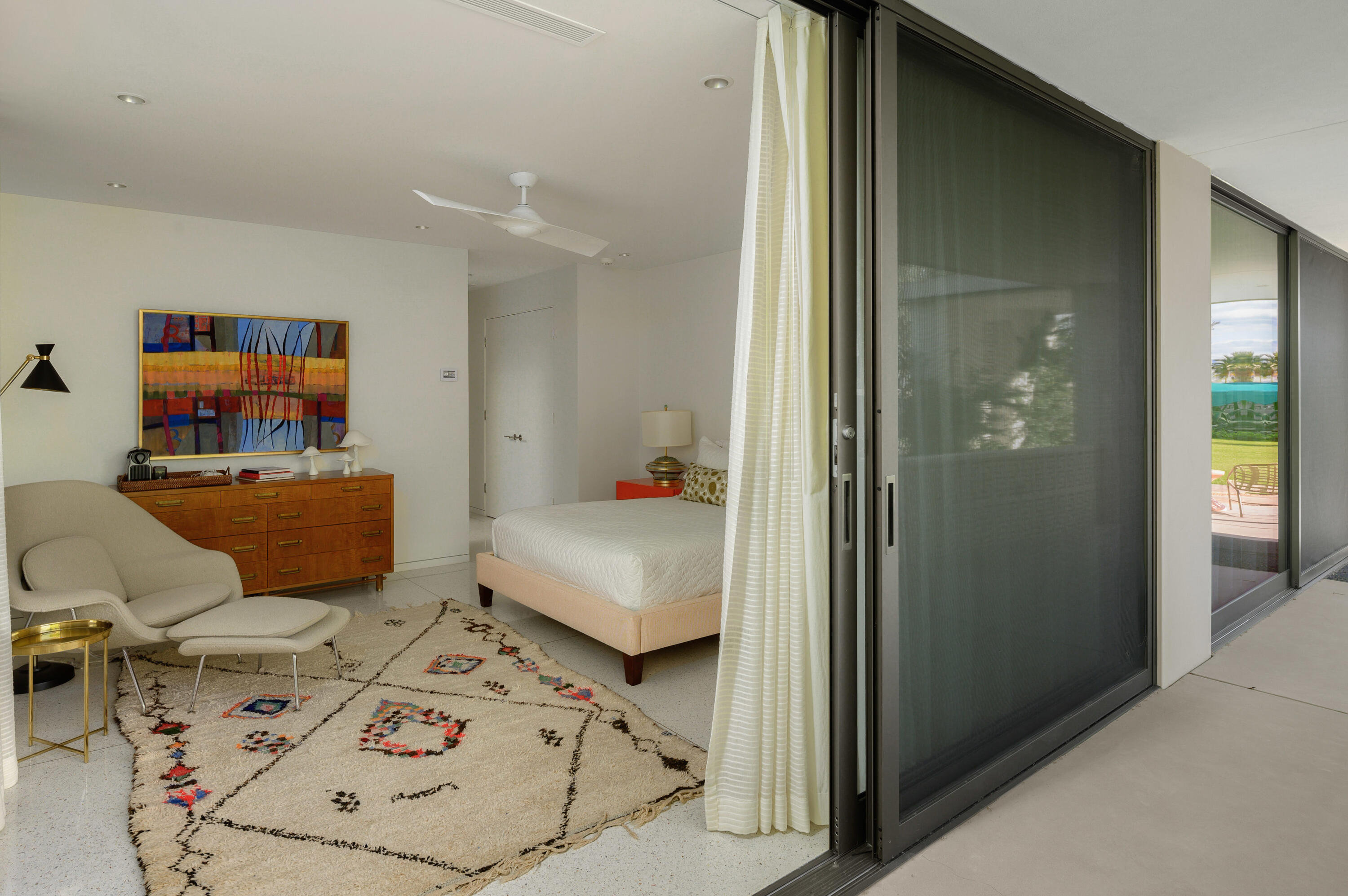 70155 Carson Road Rancho Mirage, CA 92270 - Photo 48 of 56 a bedroom with a bed and wooden floor