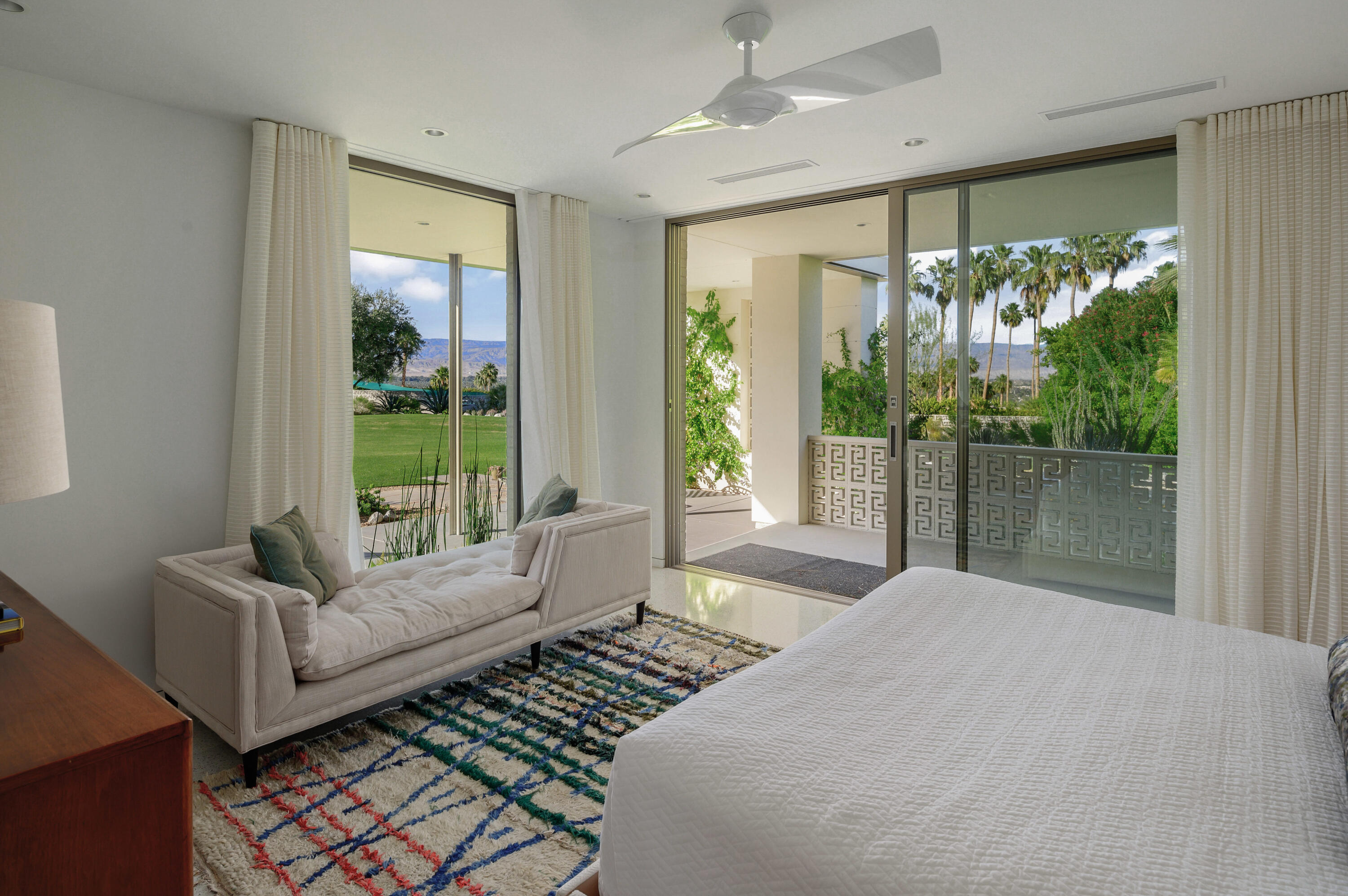 70155 Carson Road Rancho Mirage, CA 92270 - Photo 50 of 56 a bedroom with a bed and glass window