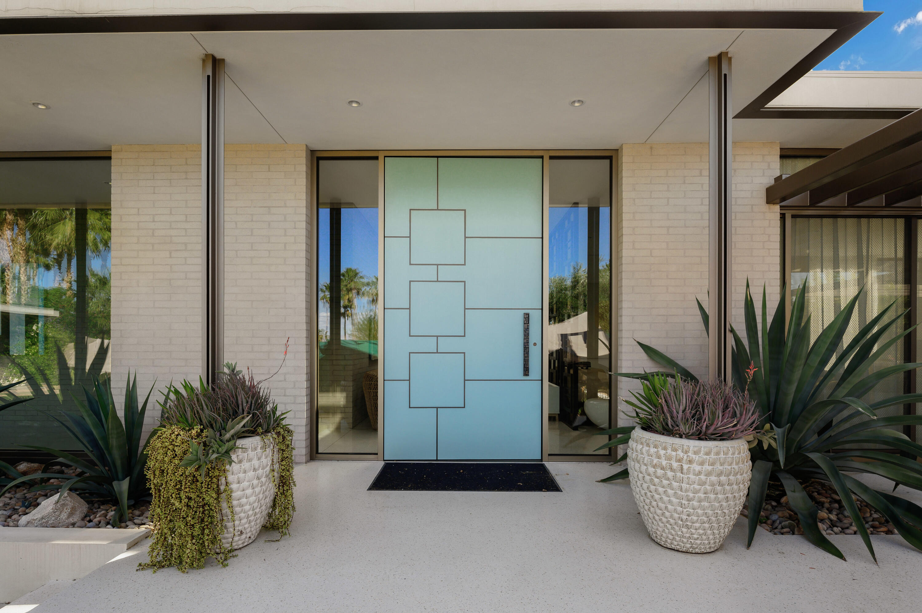 70155 Carson Road Rancho Mirage, CA 92270 - Photo 7 of 56 a view of potted plants in front of door