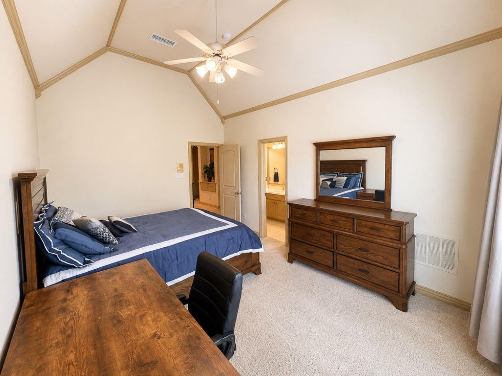 7005 Peter's Path Colleyville, TX 76034 - Photo 28 of 40 a bed room with a bed and a television