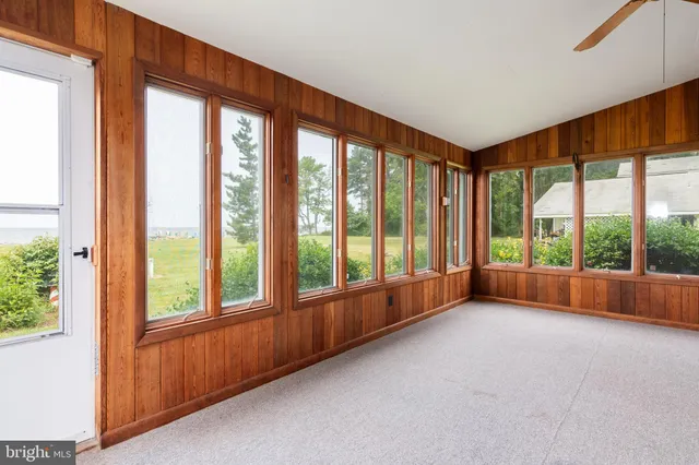 a view of room with window and bed