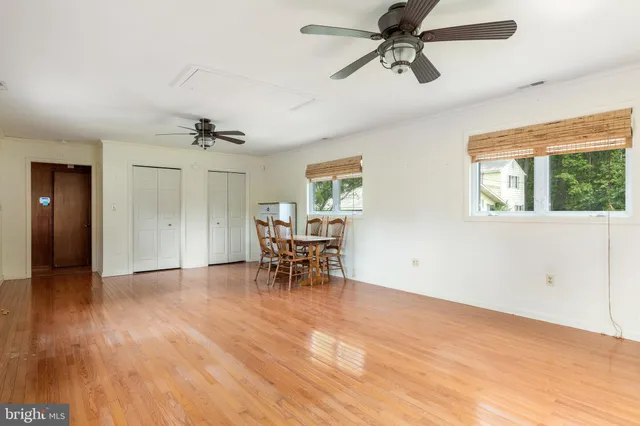 a view of a livingroom with furniture and a window
