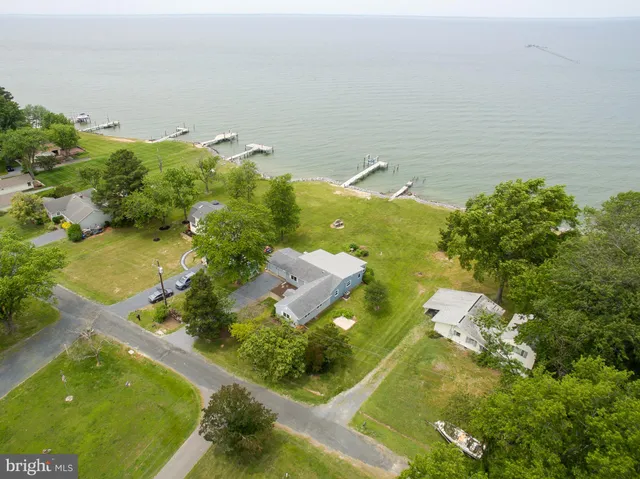 an aerial view of lake residential house with outdoor space