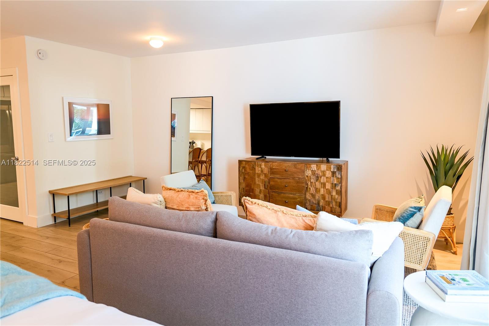 2301 Collins Avenue, Unit 329 Miami Beach, FL 33139 - Photo 11 of 47 a living room with furniture and a flat screen tv