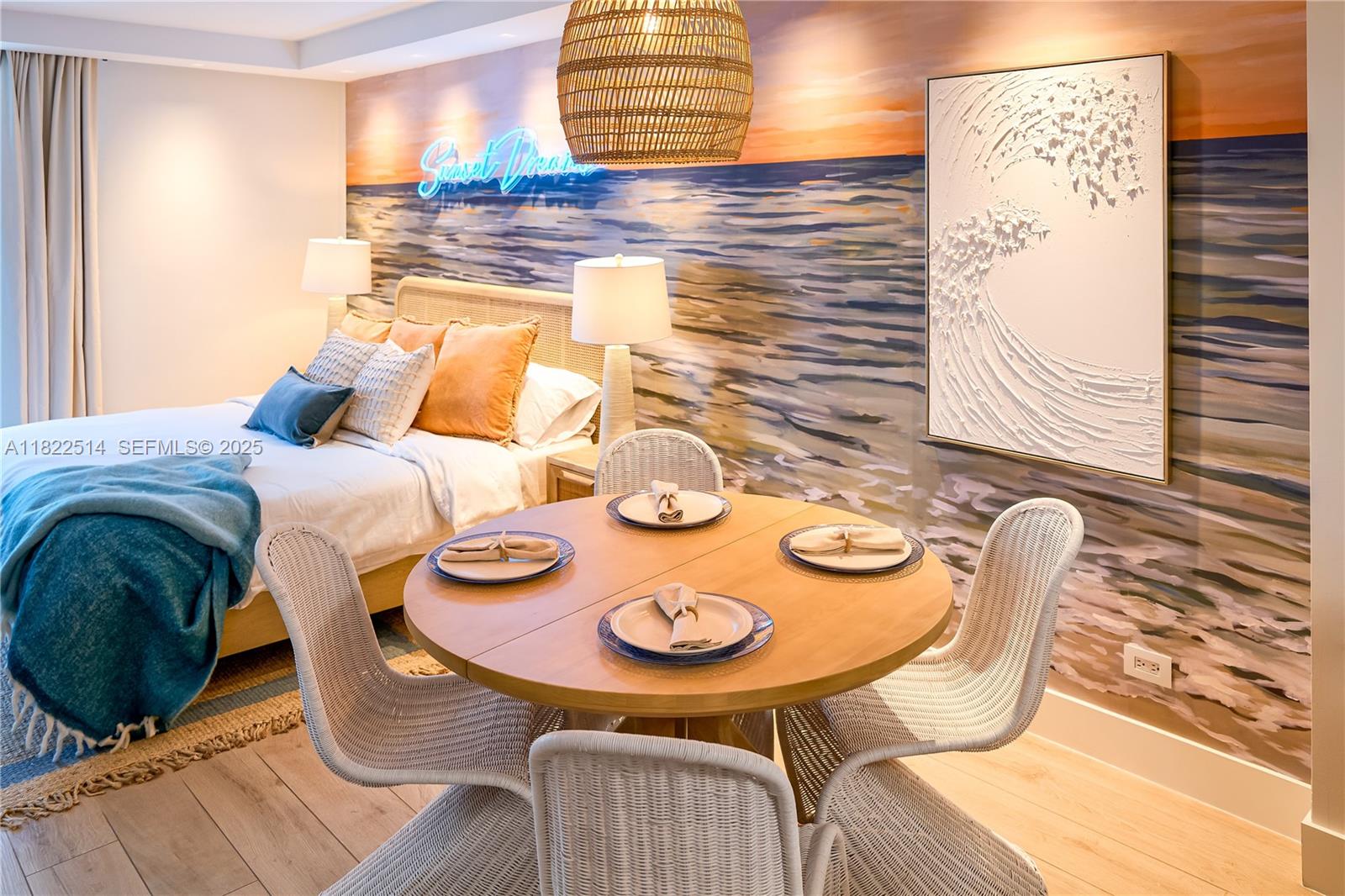 2301 Collins Avenue, Unit 329 Miami Beach, FL 33139 - Photo 13 of 47 a view of a dining room with furniture and wooden floor