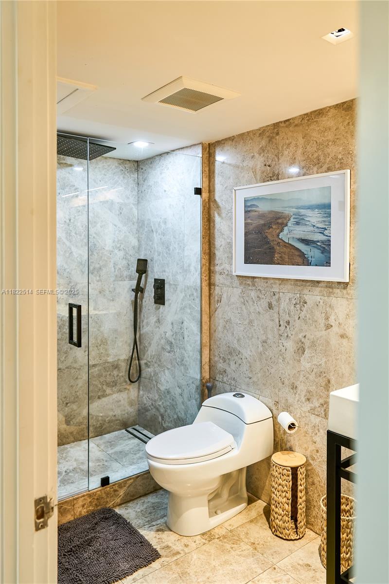 2301 Collins Avenue, Unit 329 Miami Beach, FL 33139 - Photo 17 of 47 a bathroom with a toilet and a shower