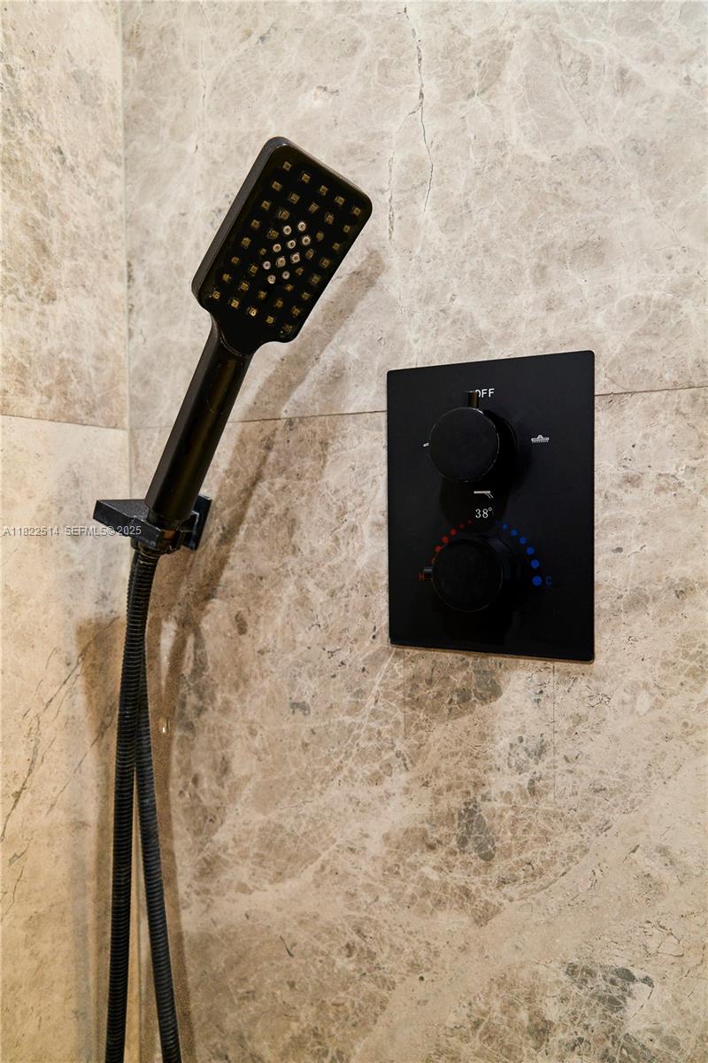 2301 Collins Avenue, Unit 329 Miami Beach, FL 33139 - Photo 18 of 47 a bathroom with a sink and a vanity