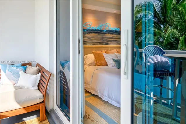 a view of a patio with a table chairs and a porch