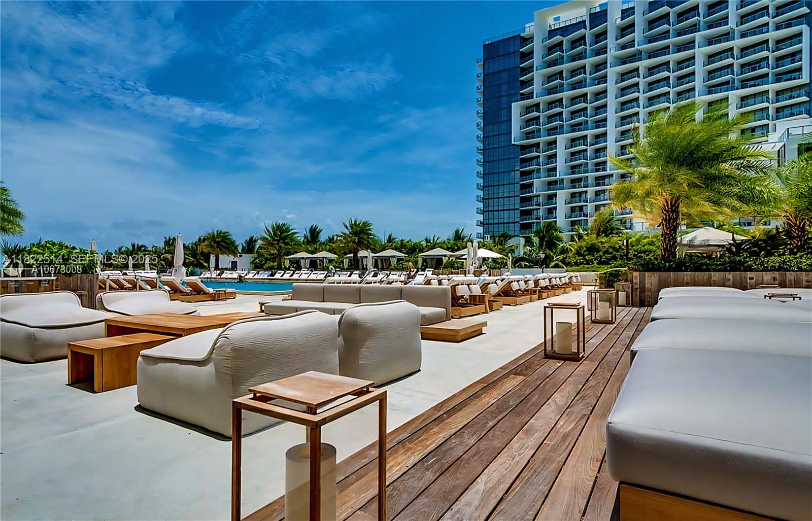 2301 Collins Avenue, Unit 329 Miami Beach, FL 33139 - Photo 39 of 47 a view of swimming pool with outdoor seating and plants