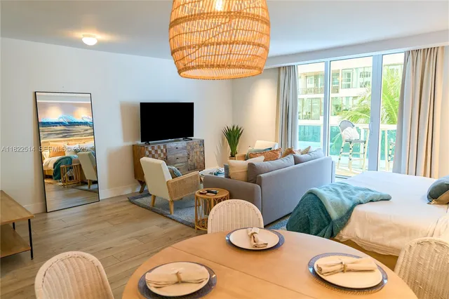 a view of a dining room with furniture and wooden floor