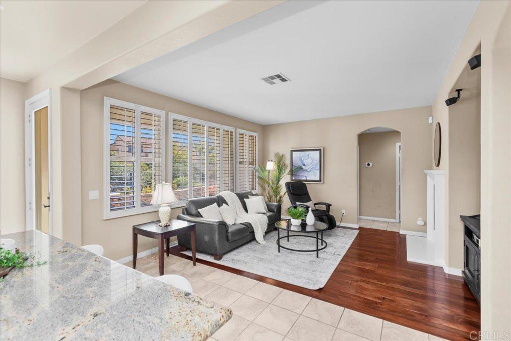 838 Luminara Way San Marcos, CA 92078 - Photo 21 of 54 a living room with furniture and a large window
