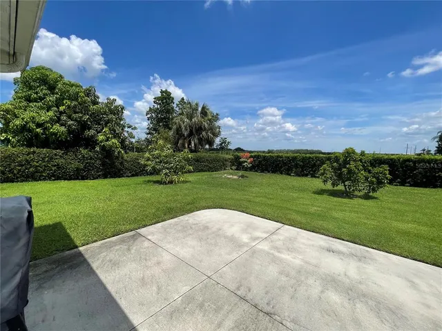 a view of a house with a big yard